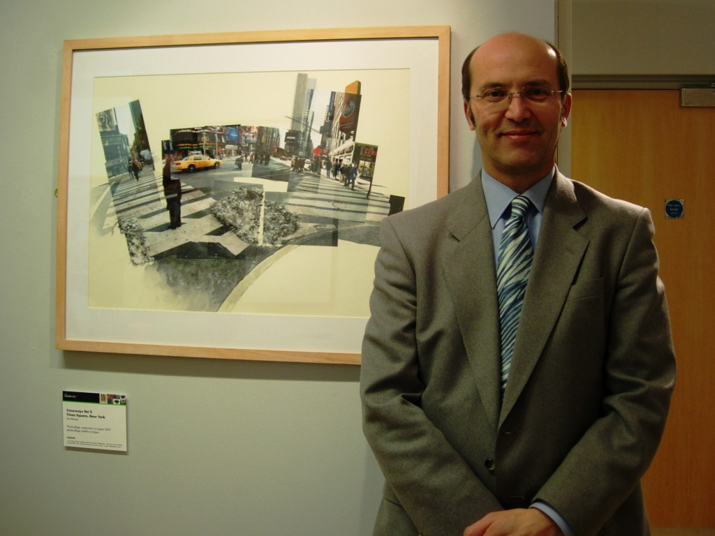 Ceri Thomas with one of his New York photocollage and watercolour pictures, March 2011